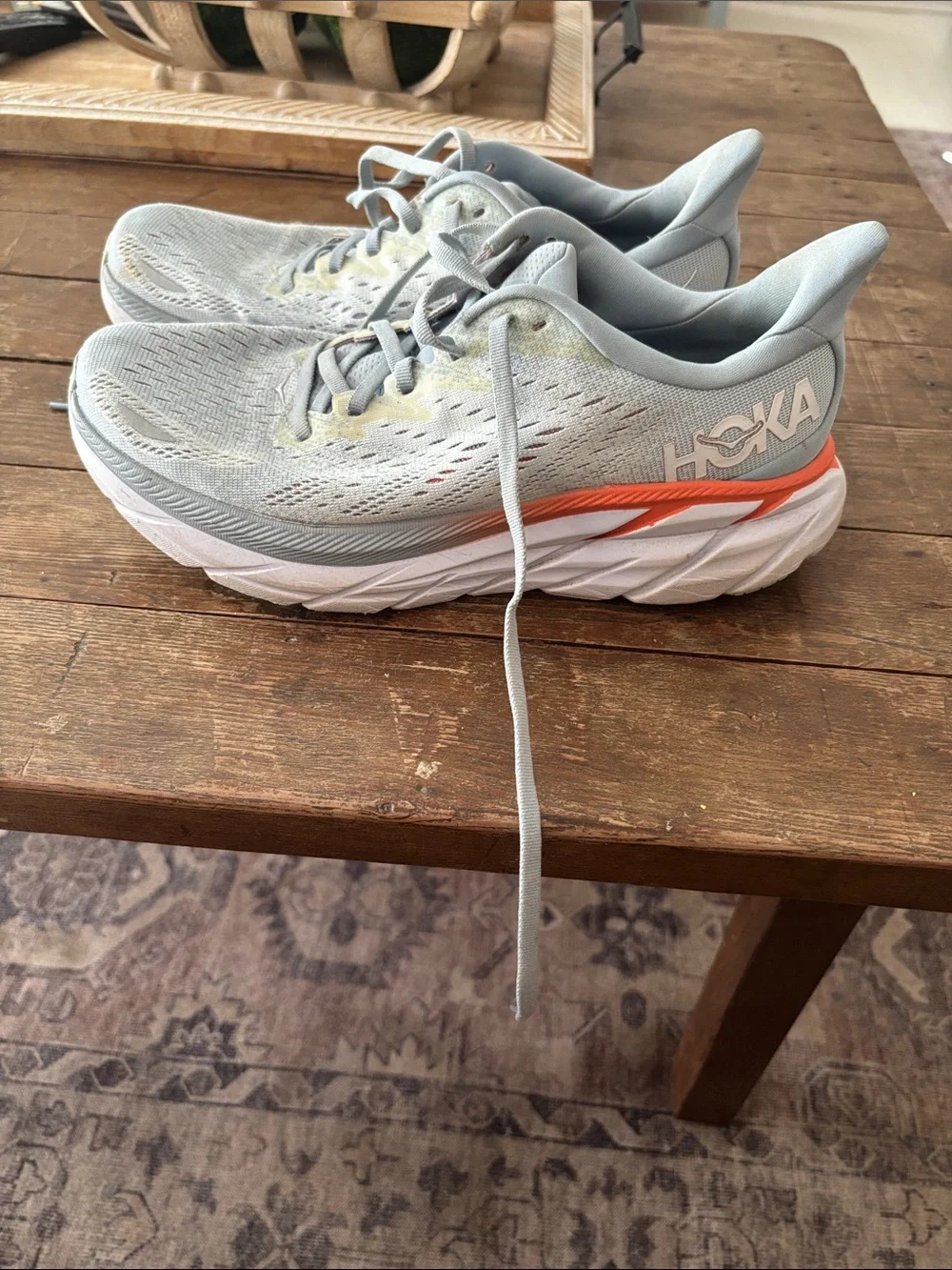 Hoka Women's Athletic Shoes in Light Gray with Orange Accent